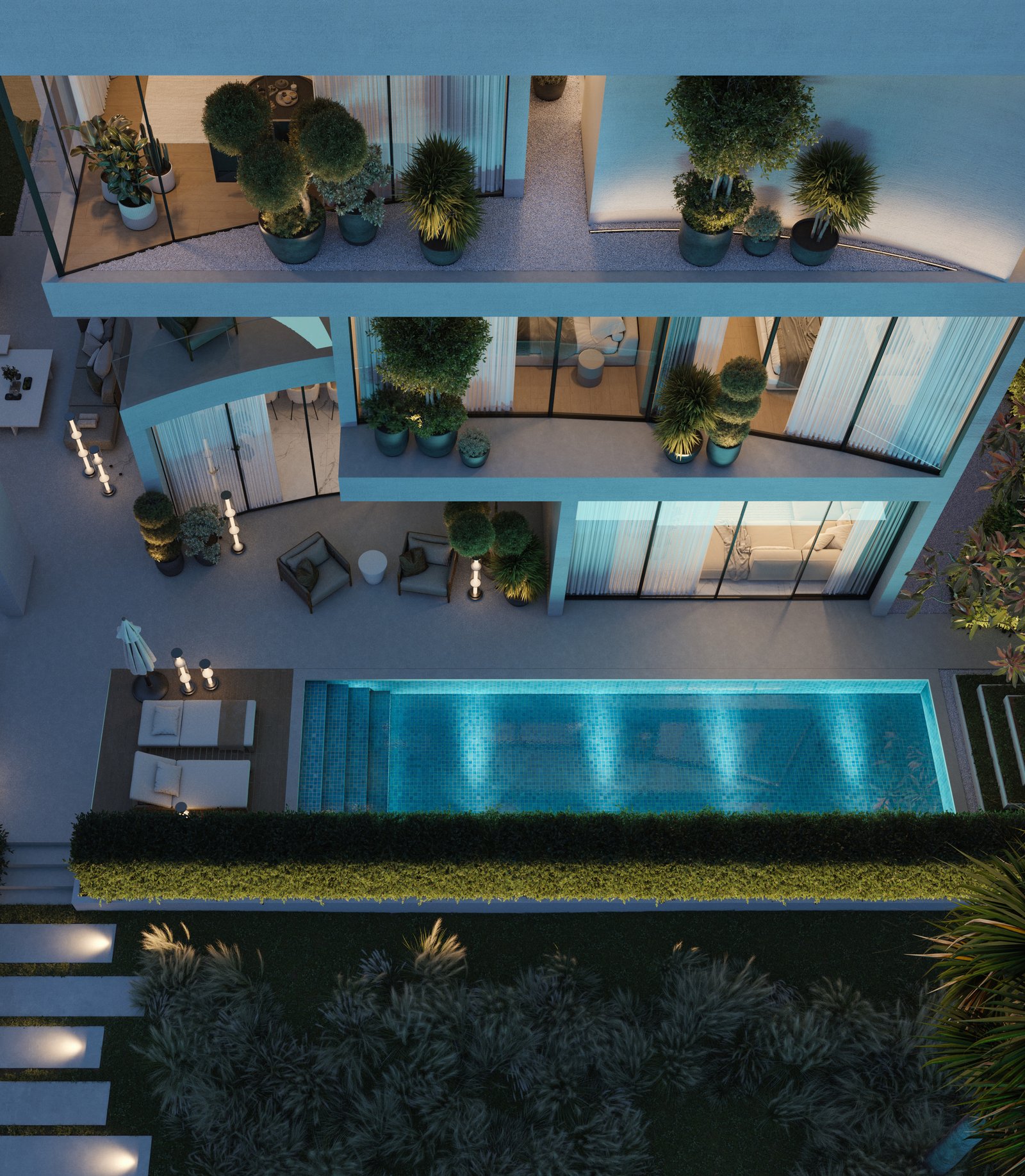 Lunaya villa at night with illuminated pool and lagoon views